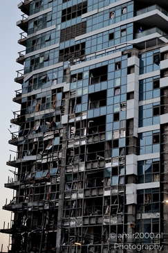 Urban landscapes in Ramat Gan showing visible signs of missile impact, a quiet documentation of structural damage and everyday resilience in times of conflict. Photographed by Amir Darzi. Photography by amir2000.nl, a Dutch photographer.