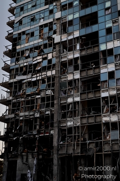 Urban landscapes in Ramat Gan showing visible signs of missile impact, a quiet documentation of structural damage and everyday resilience in times of conflict. Photographed by Amir Darzi. Photography by amir2000.nl, a Dutch photographer.